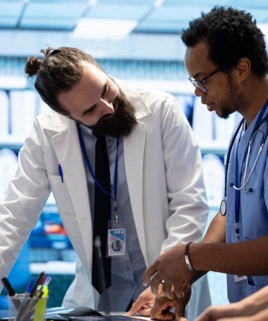 Clinicians reviewing health system data
